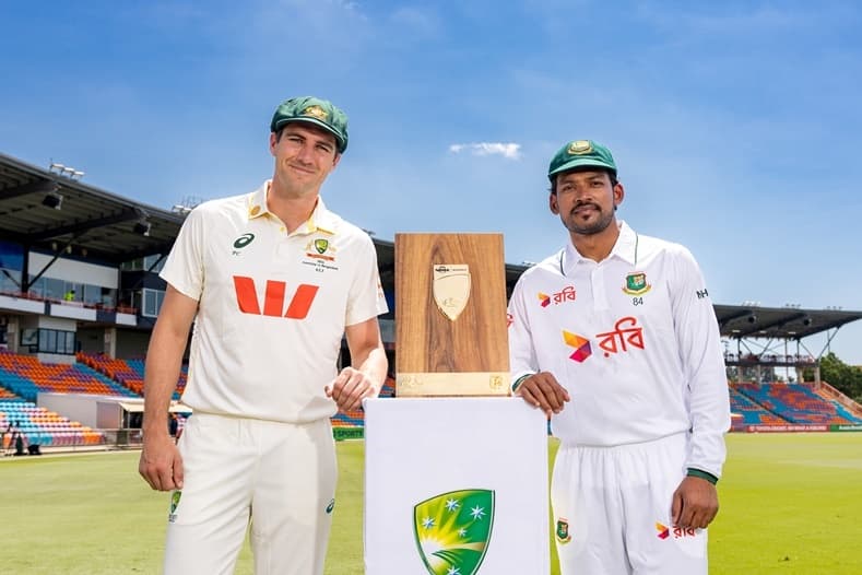 Two captains smiling with the trophy ©Azhar Niaz Chattha/CA